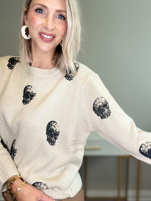 BLACK SKULLS ON TAN SWEATER