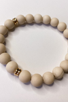 THE MATTE CREAM AND GOLD RING ACCENTS BRACELET