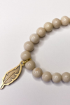 THE CREAM GEMSTONE FEATHER CHARM BRACELET
