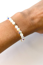 THE SMALL CLEAR SWAROVSKI CRYSTAL WITH GOLD DISCS BRACELET